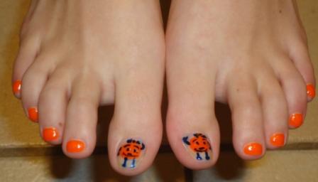 Last time Syracuse was number one in basketball, Jaime painted her toenails orange.  She even got Otto (Syracuse's mascot), too!  My wife is awesome!