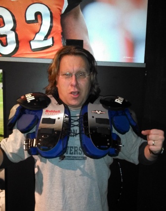 At the Gridiron Glory exhibit from the Pro Football Hall of Fame, I tried on a pair of shoulder pads.