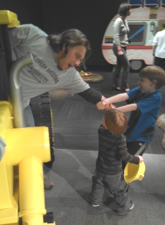 Dylan and Harry pull me out of a "Bob the Builder" exhibit.  I guess they wanted a try, too!  